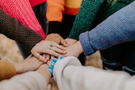 A photo of hands together in partnership