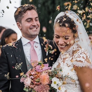 A couple are showered with confetti in Offham